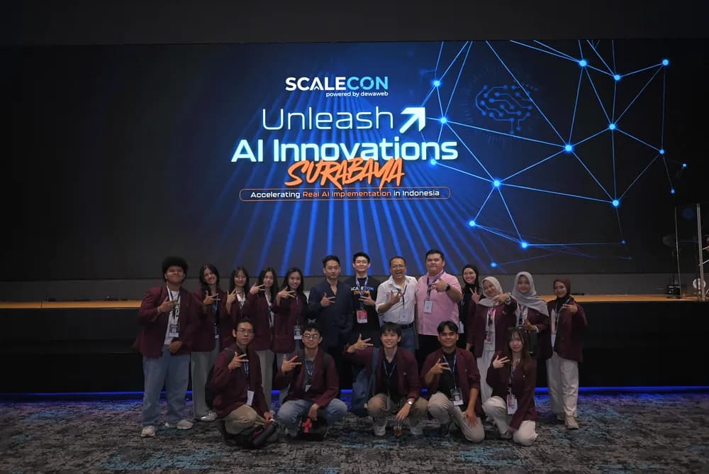 A community group photo on stage at SCALECON Surabaya 2026