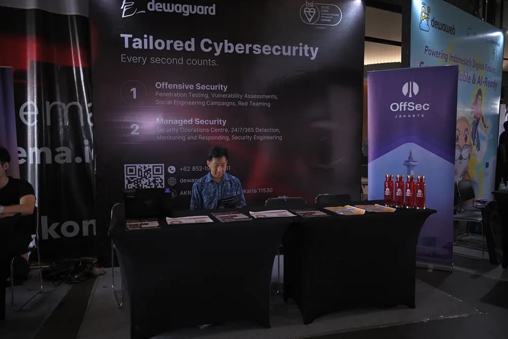 A cybersecurity exhibitor stand in the SCALECON Surabaya 2026 exhibition