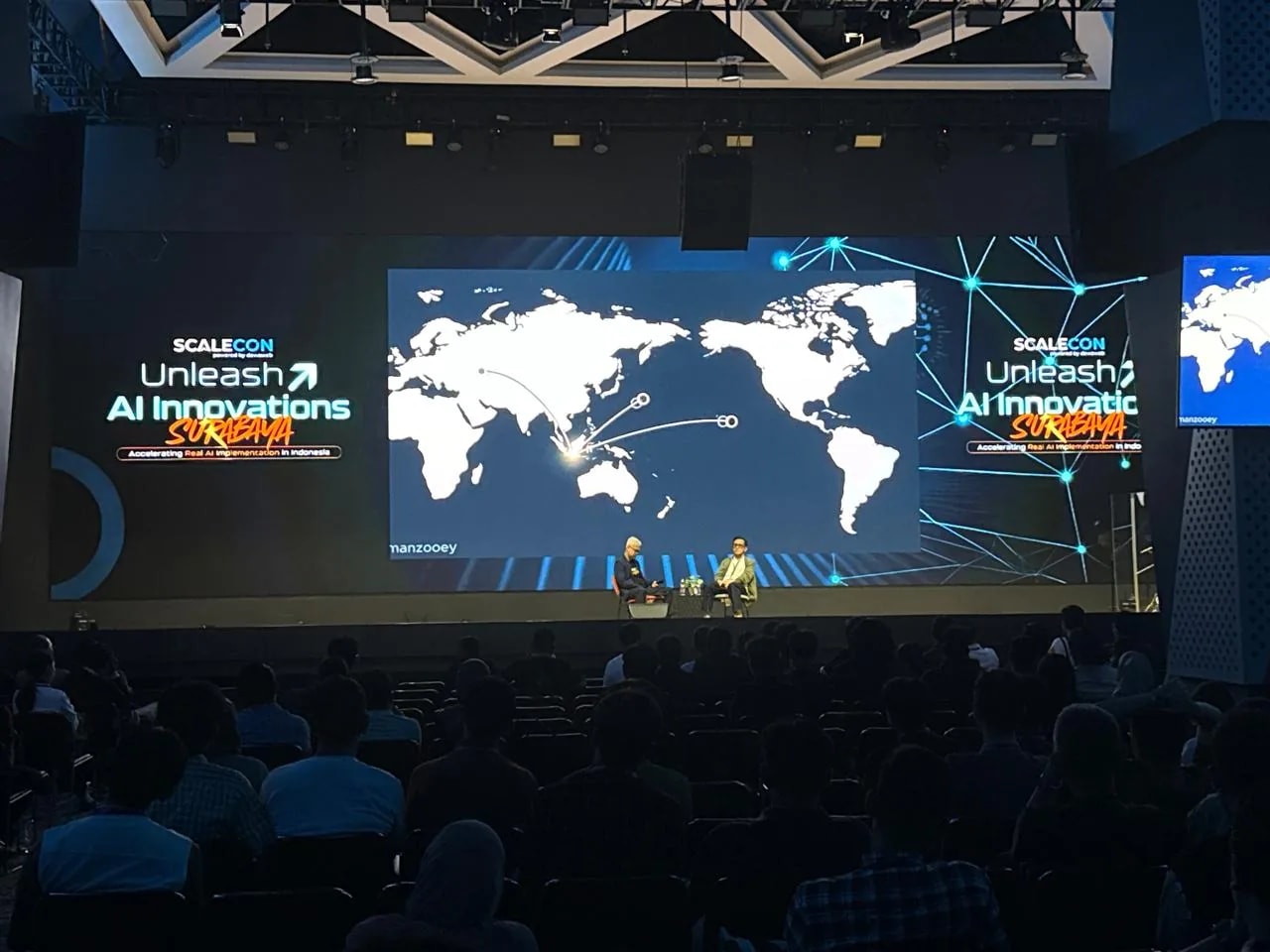 A fireside conversation on the SCALECON Surabaya 2026 main stage in front of a full audience