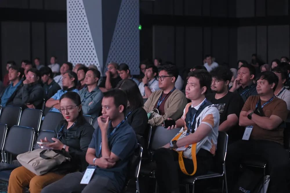 Attendees watching intently from the front rows at SCALECON Surabaya 2026